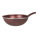 Brown speckled wok with a silver interior on a white background