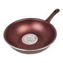 Brown speckled frying pan with a brand label on a white background