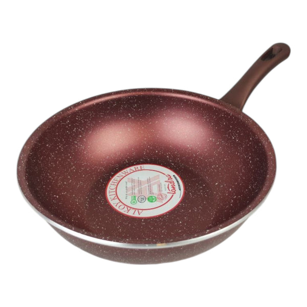 Brown speckled frying pan with a brand label on a white background