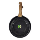 Black frying pan with a wooden handle on a white background