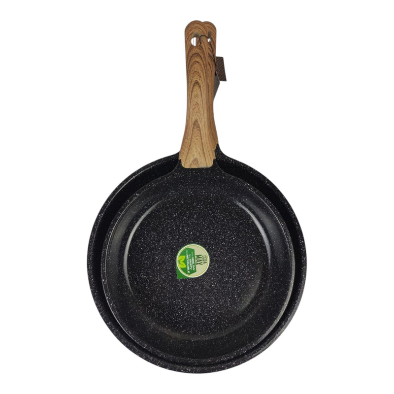 Black frying pan with a wooden handle on a white background