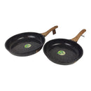 Two black frying pans with wooden handles on a white background