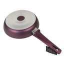 Purple frying pan with a white handle on a white background