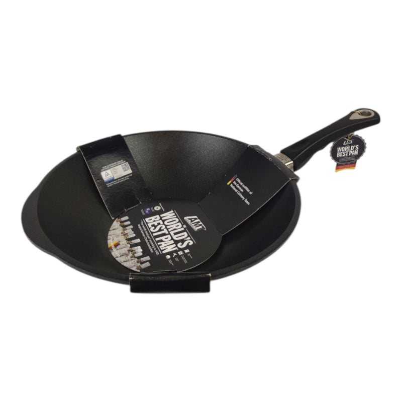 Black wok with a handle on a white background