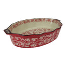 Decorative ceramic baking dish with red floral pattern on a white background