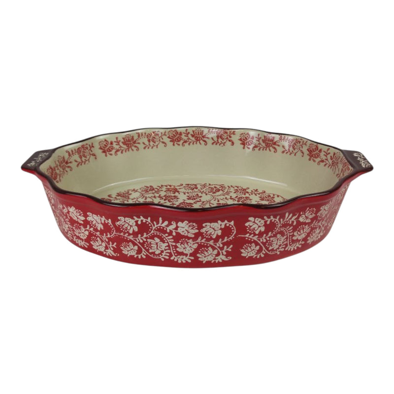 Red and white floral-patterned ceramic baking dish on a white background