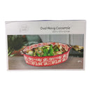 Red oval wavy casserole dish with floral patterns on a white background