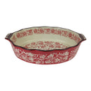 Decorative ceramic baking dish with red and white floral pattern on a white background