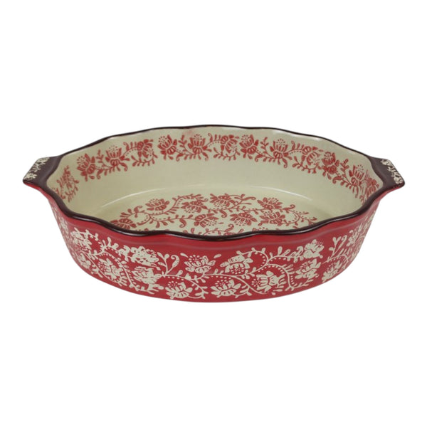 Decorative ceramic baking dish with red floral pattern on a white background