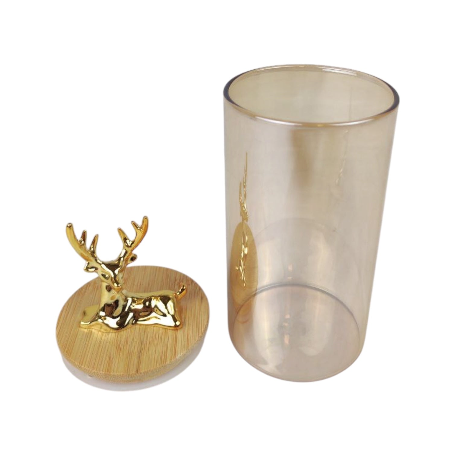Glass tumbler with gold deer design on a white background
