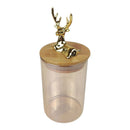 Clear glass jar with a gold deer-shaped lid on a white background