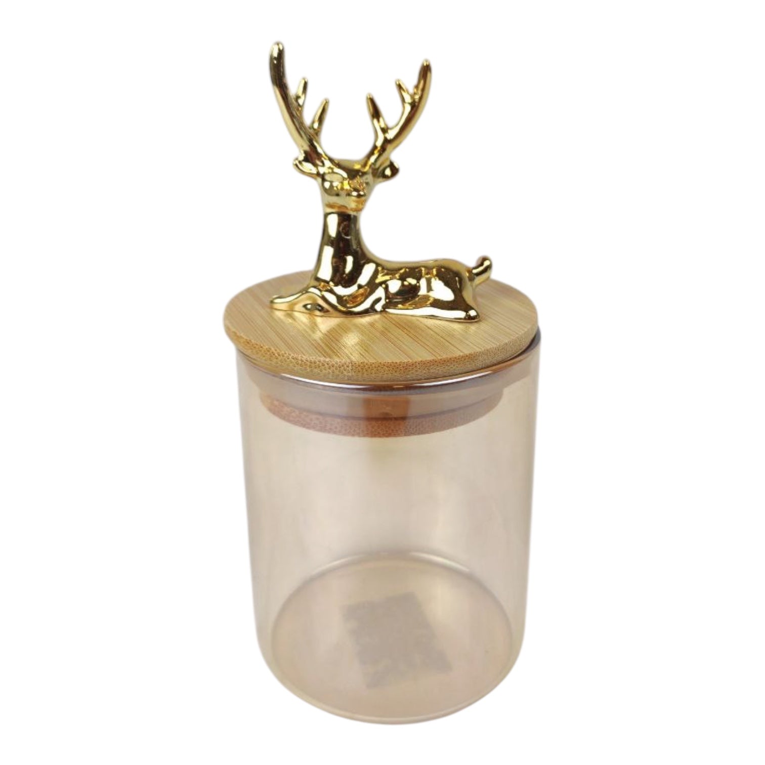Clear glass jar with a gold deer-shaped lid on a white background