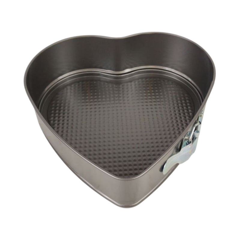 Heart-shaped metal baking pan on a white background