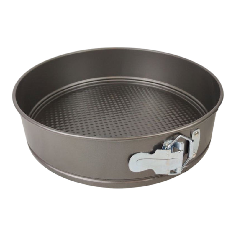 Metal springform pan with a release lid on a white background
