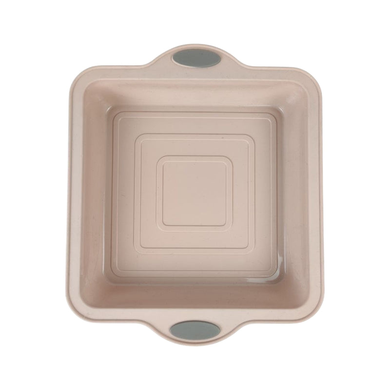 Beige baking dish with handles on a white background