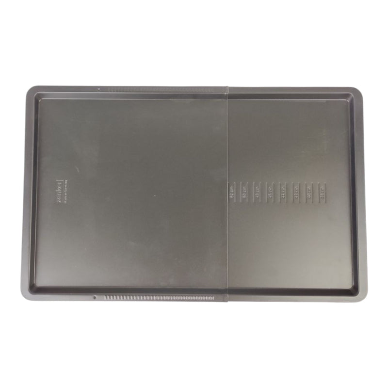 Baking tray with a non-stick surface on a white background