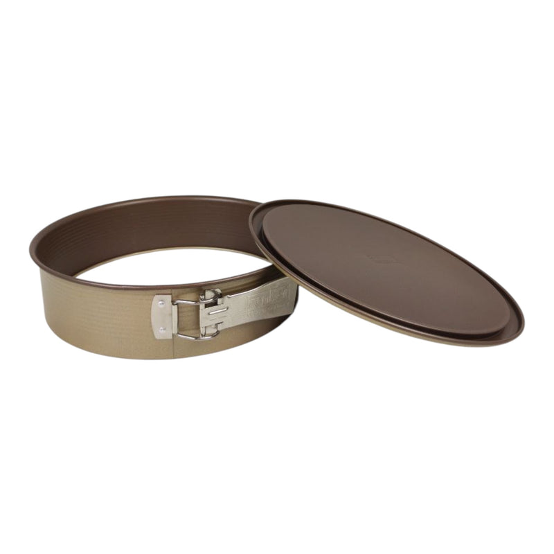 Round metal cake pan with a lid on a white background