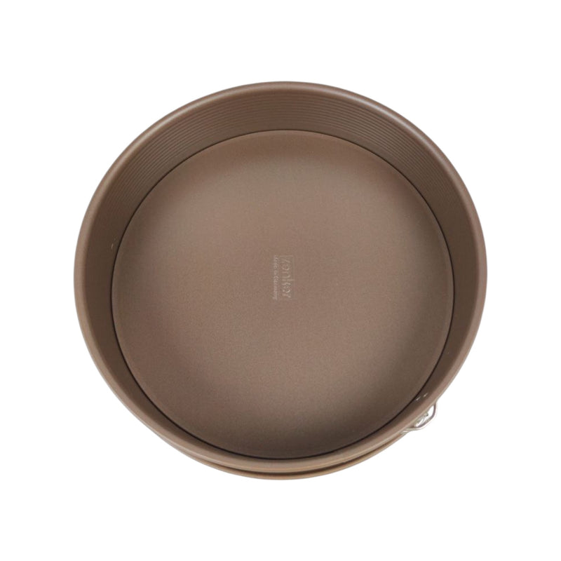 Brown round cake pan on a white background