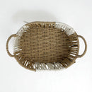Woven basket with handles on a white background