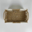 Woven rectangular basket with handles on a light gray background