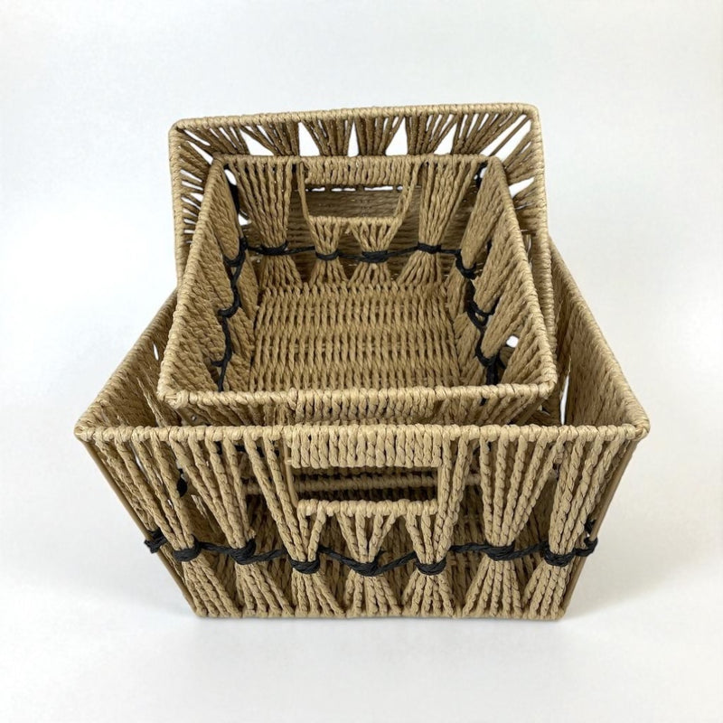 Set of three woven baskets with black bands on a white background