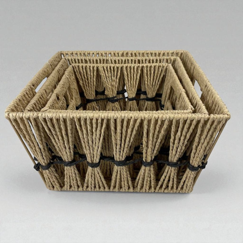Woven basket with black ties on a gray background