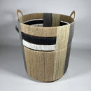 Woven basket with striped pattern on a gray background