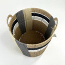 Woven basket with handles on a white background