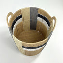 Woven basket with striped pattern on a white background