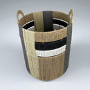 Woven basket with striped pattern on a white background