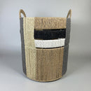 Woven basket with gray and natural woven design on a light gray background
