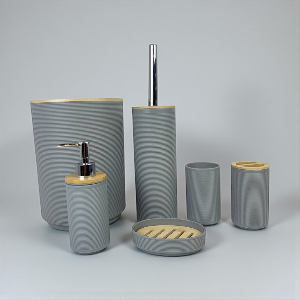 Bathroom accessory set with gray and wooden elements on a light gray background