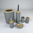 Gray bathroom accessory set with wooden accents on a gray background