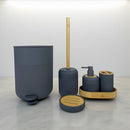 Bathroom accessory set with blue containers and wooden elements on a light gray surface.