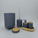 Bathroom accessory set with blue containers and wooden elements on a gray background