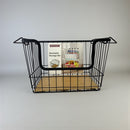 Black wire storage bin with a wooden base on a gray background