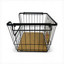 Black wire basket with wooden base on a white background