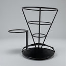 Black metal umbrella stand on a gray background