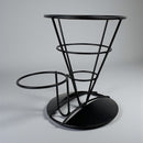 Black metal bar stool with a modern design on a gray background