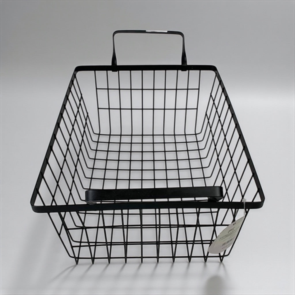 Black wire basket with handle on a gray background