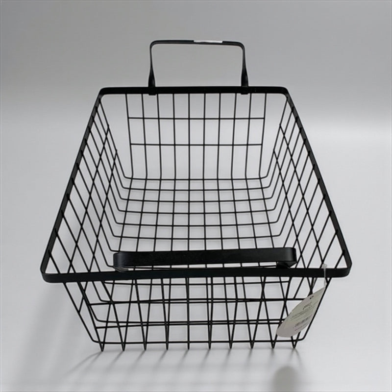 Black wire basket with handle on a gray background