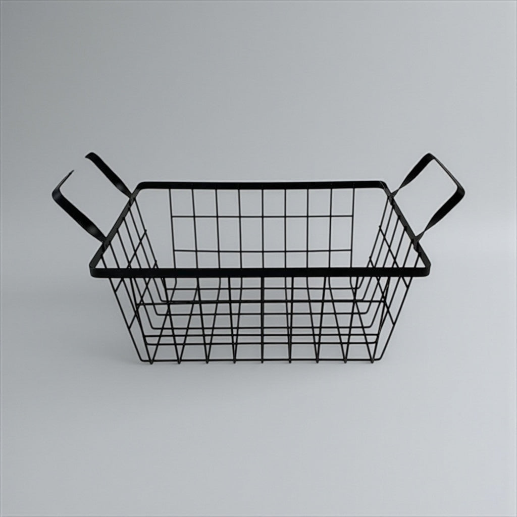 Black metal wire basket with handles on a gray background