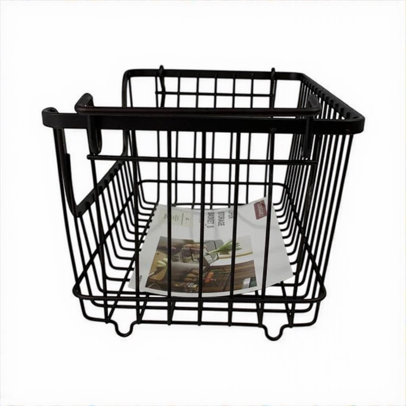 Black wire basket with magazines on a white background