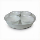 Set of four white bowls stacked inside a larger white bowl on a white background