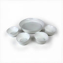 Set of white ceramic bowls on a white background