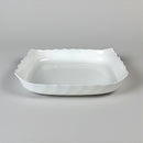 White ceramic dish on a gray background