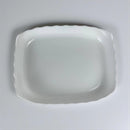 White ceramic platter on a light gray background