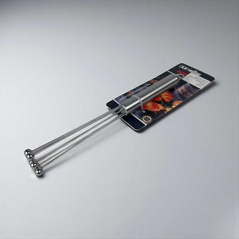 Metal whisk on a gray background with packaging available at cupindy.com