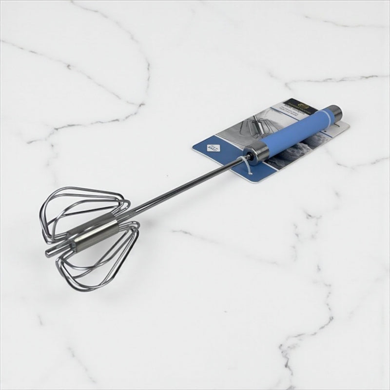 Metal whisk with blue handle on a marble surface available at cupindy.com