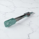 Teal spatula and tongs on a marble surface available at cupindy.com